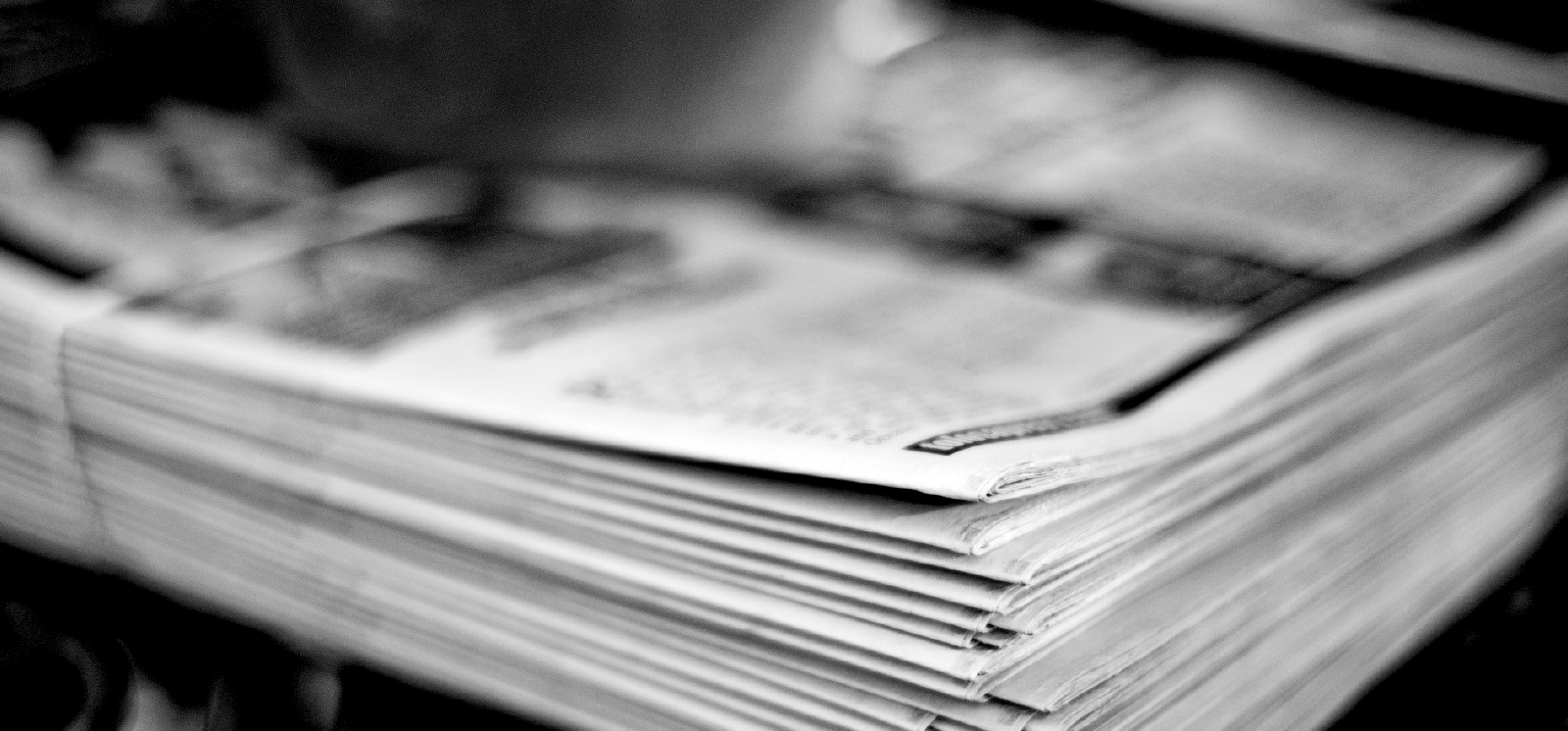 newspaper stack on table